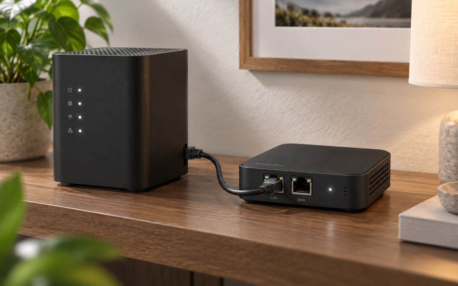 Velmo One next to a home router, connected with a short cable